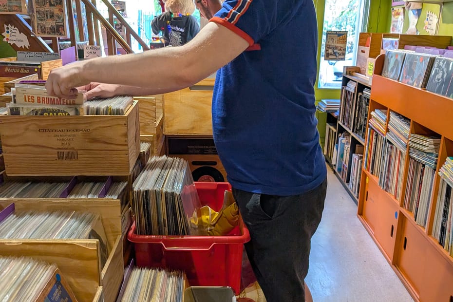 Gazfunk browsing vinyl records inside Electric Monk record shop in Nice, France.